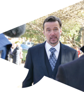 A photo of Dr Devin Bowles speaking seriously